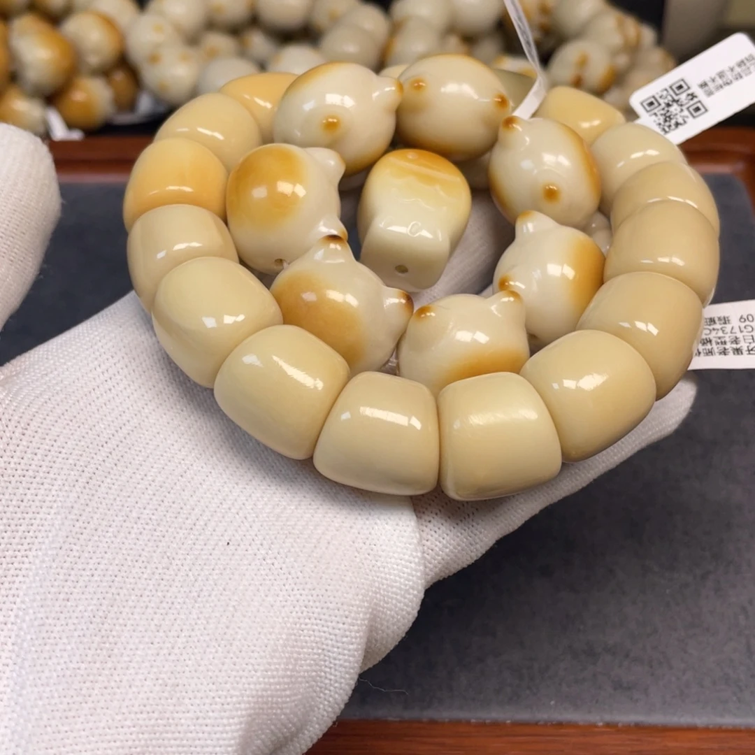 鸦***羽手串菩提根/象牙果125桶珠瑕疵猫头微瑕大肠微瑕