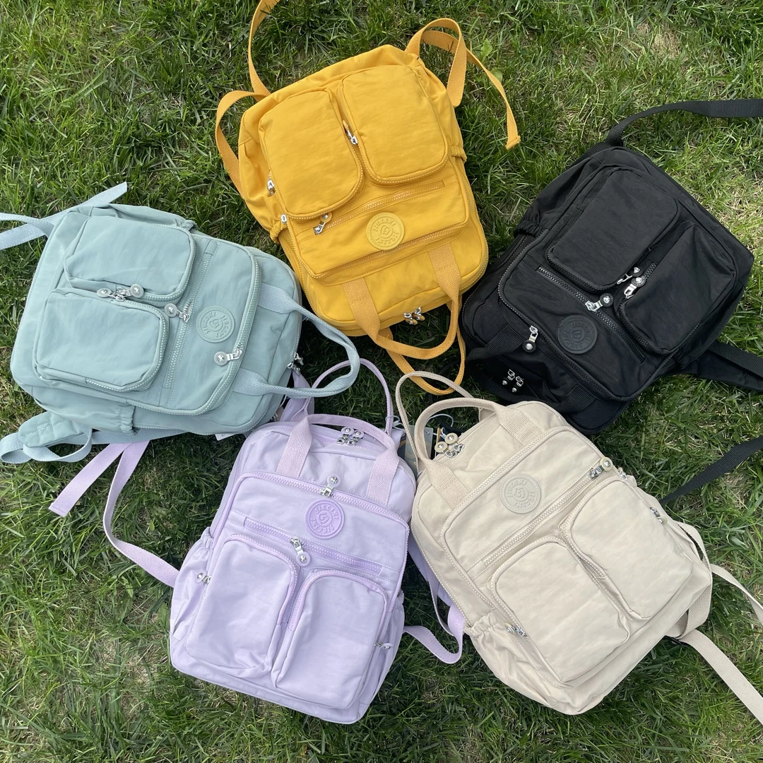 新品韩版双肩背包大容量轻便防水旅行包简约多口袋妈咪包学生书包