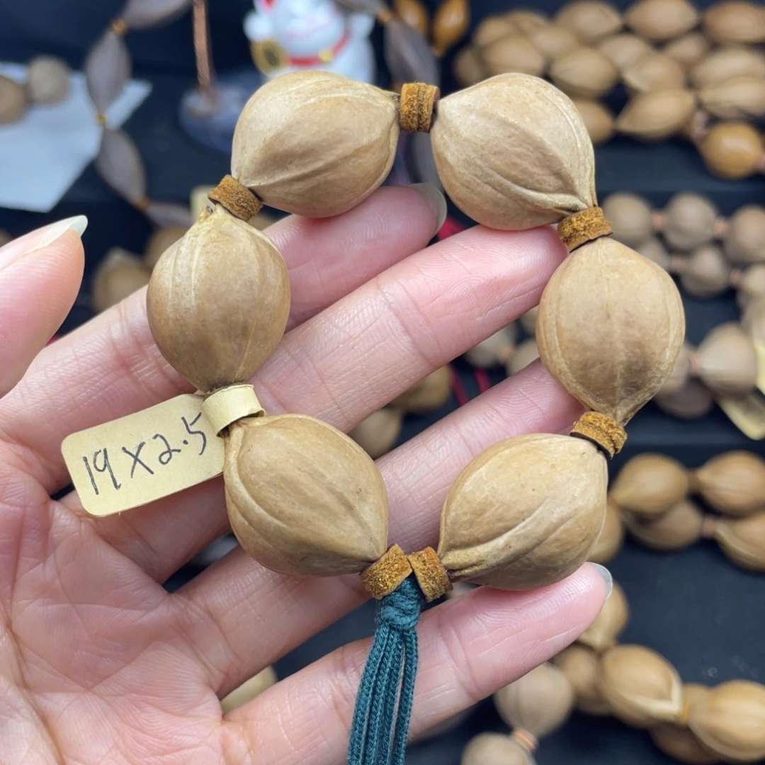 用***4001橄榄核三花手捻19*25