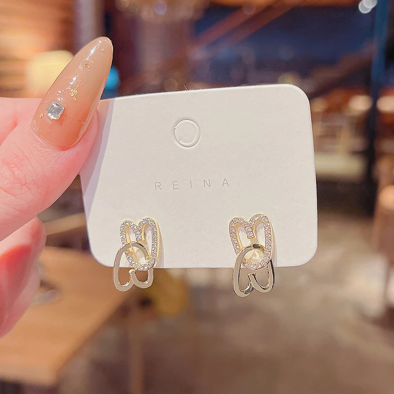 黄铜耳饰 S925银针心连心爱意转动耳环微镶满钻超闪耳钉个性简约