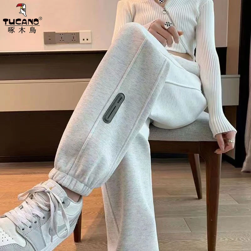 啄木鸟2025秋冬新款加绒加厚束脚运动裤女宽松显瘦外穿休闲哈伦裤