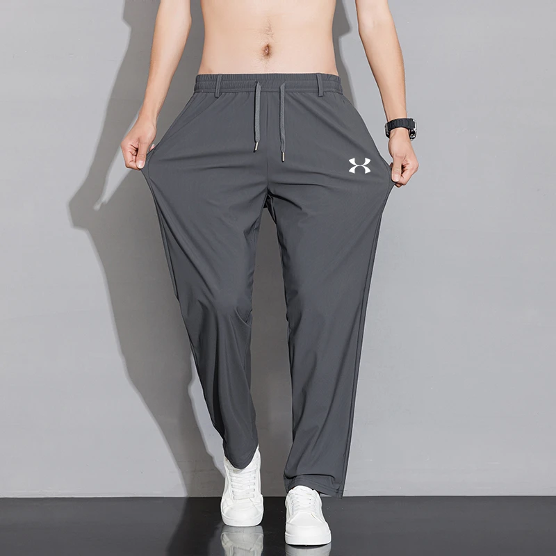 UA安德瑪休闲裤男士冰丝夏季薄款弹力运动透气大码潮流休闲长裤子
