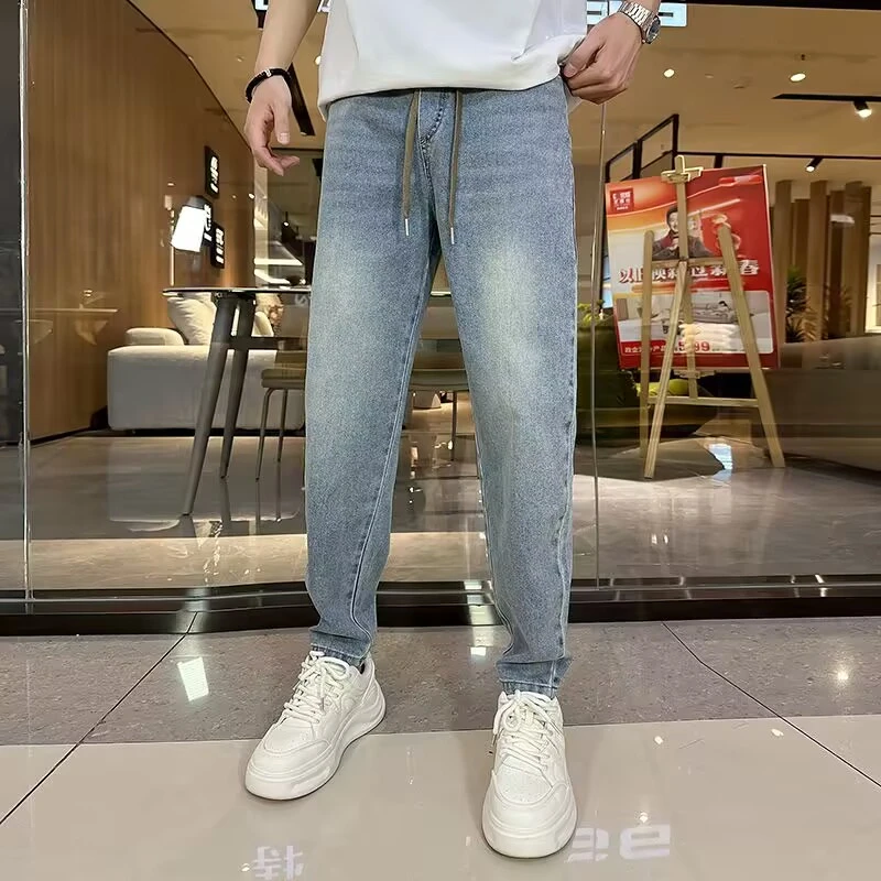 夏季新款男士蓝色牛仔裤宽松哈伦裤松紧腰萝卜裤休闲长裤小脚裤潮