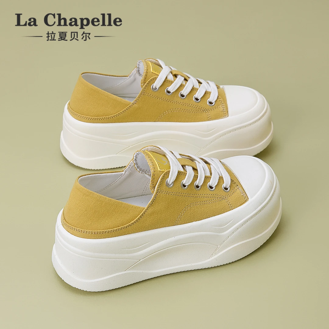 拉夏贝尔黄色帆布鞋女2025新款冬季软底不累脚厚底增高休闲板鞋子