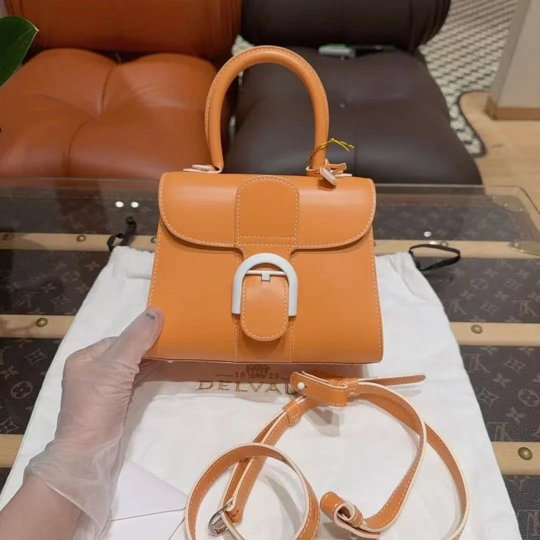 99新 Delvaux/德尔沃 brillant mini 橙色牛皮 白色陶瓷扣
