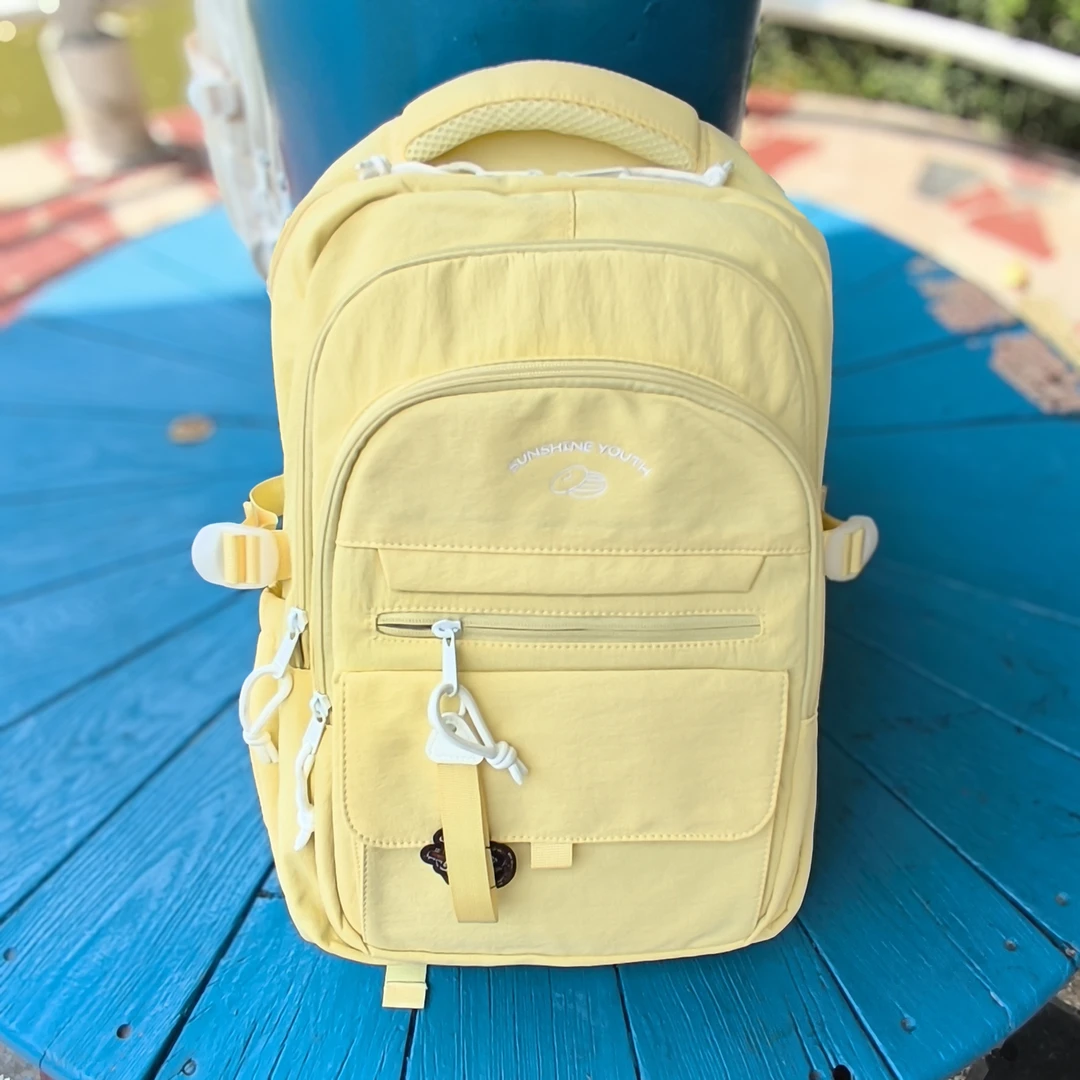 百搭潮流通用双肩包休闲轻便防水学生书包初中背包高中生双肩包