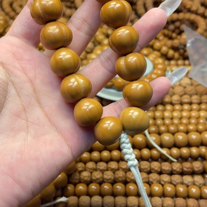 崇***饼核桃全品亮面屁桃手持
