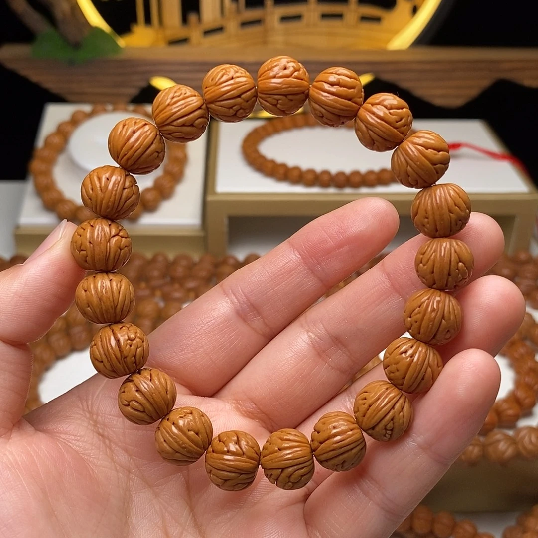 桃核手串11mm野生金麒麟桃核手串