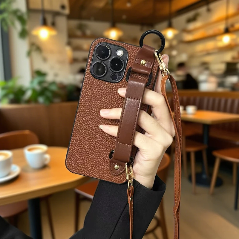 适用苹果16promax手机壳iphone15手腕带14plus斜跨绳13支架12荔枝