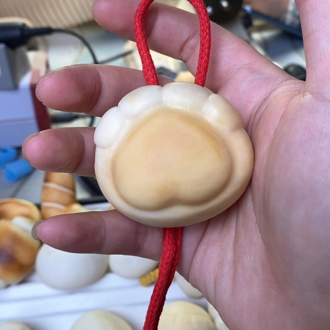 菩提根/象牙果把件于***?象牙果定制大猫爪打孔编绳