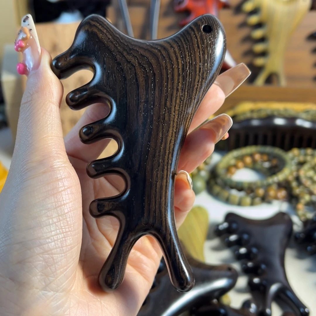 过***.紫光檀大板四合一按摩梳