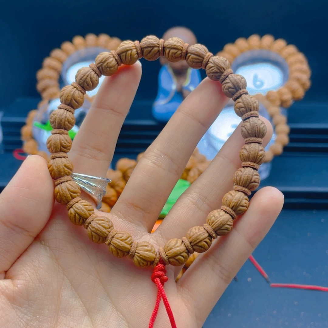 梁***梁桃核吊坠满天星 闪电购8号车