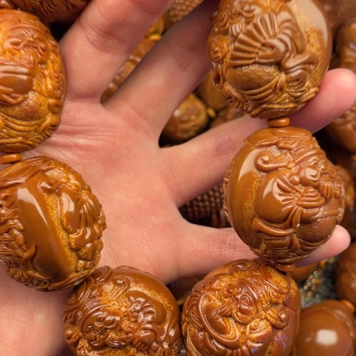 橄榄核吊坠潍****司橄榄核手持