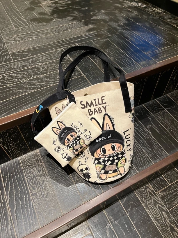 印花卡通布布水桶包双根单肩包网红灯芯绒帆布包包百搭韩版