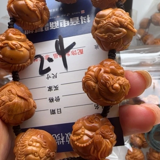 大***告橄榄核手串橄榄雕工艺品