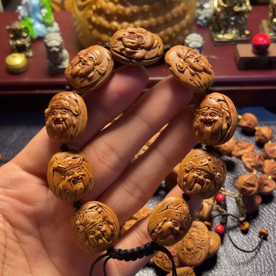 大桃核雕刻瑕疵财神头