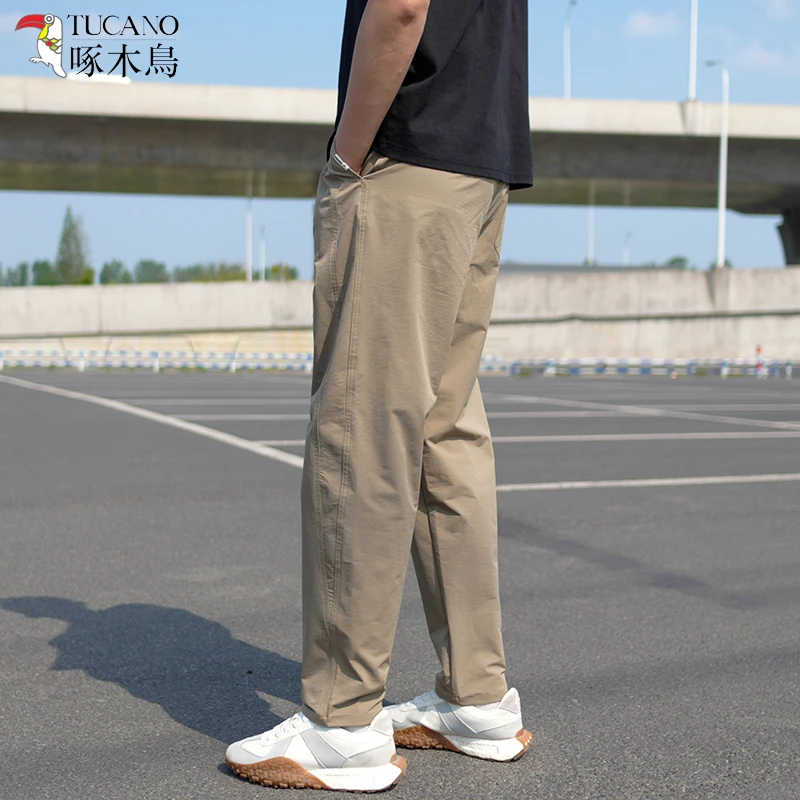 TUCANO/啄木鳥夏季薄款休闲裤男士户外松紧腰时尚休闲透气弯刀裤