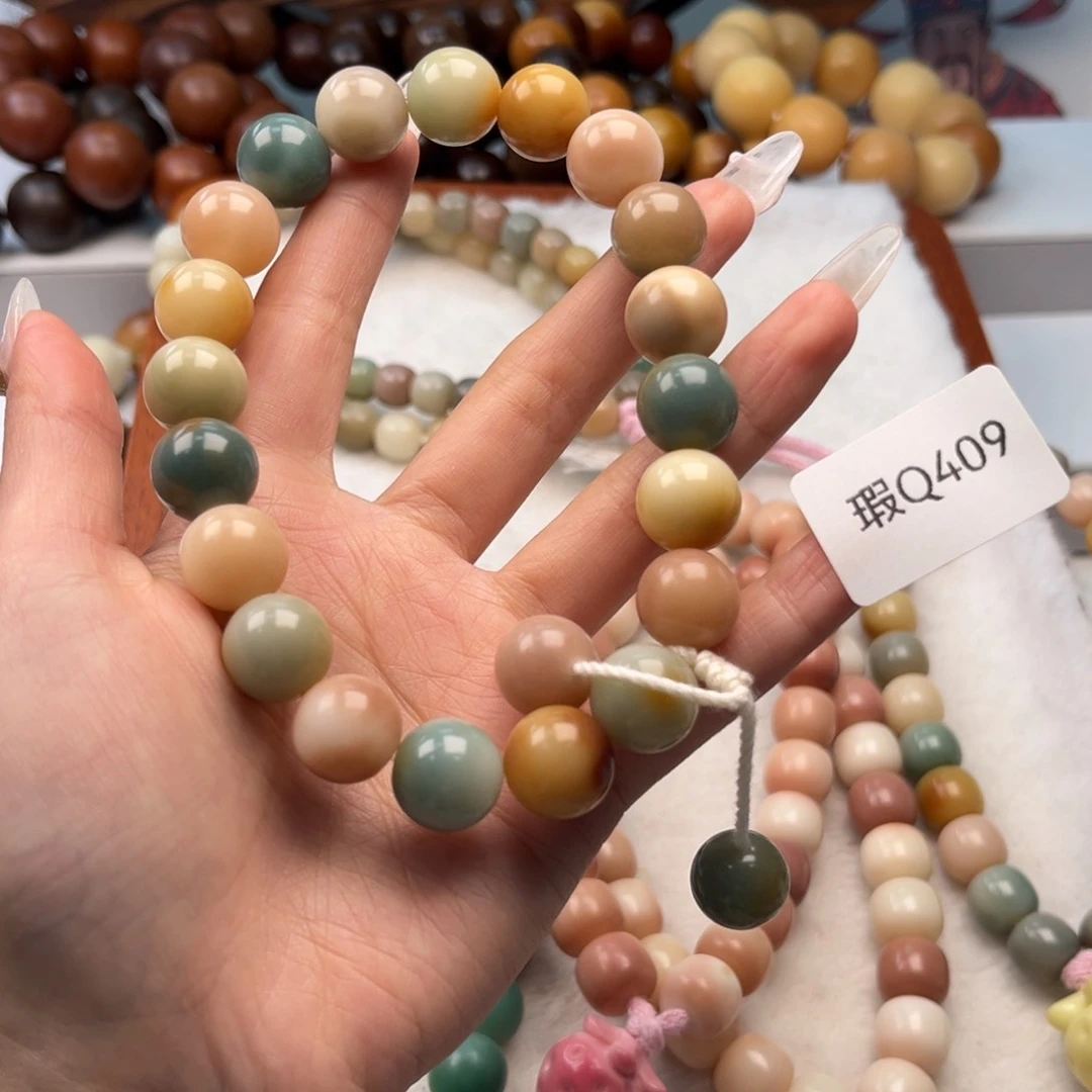 菩提根/象牙果手串失****?12mm瑕手持一串q409