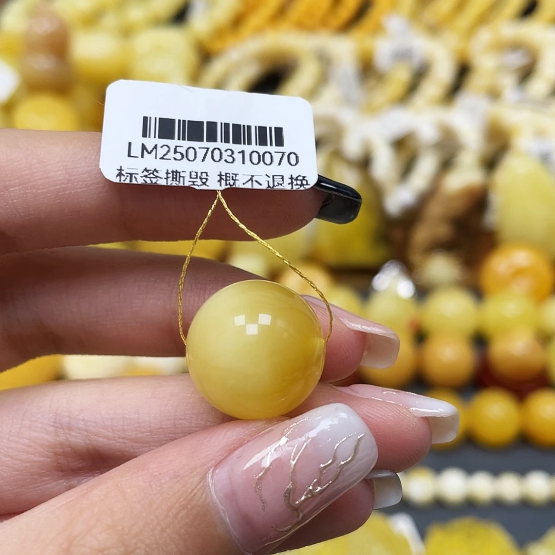 张***r琥珀未镶嵌裸石16.1mm圆珠蜜蜡 俏色