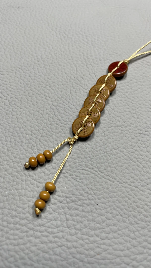 五帝钱橄榄核雕刻