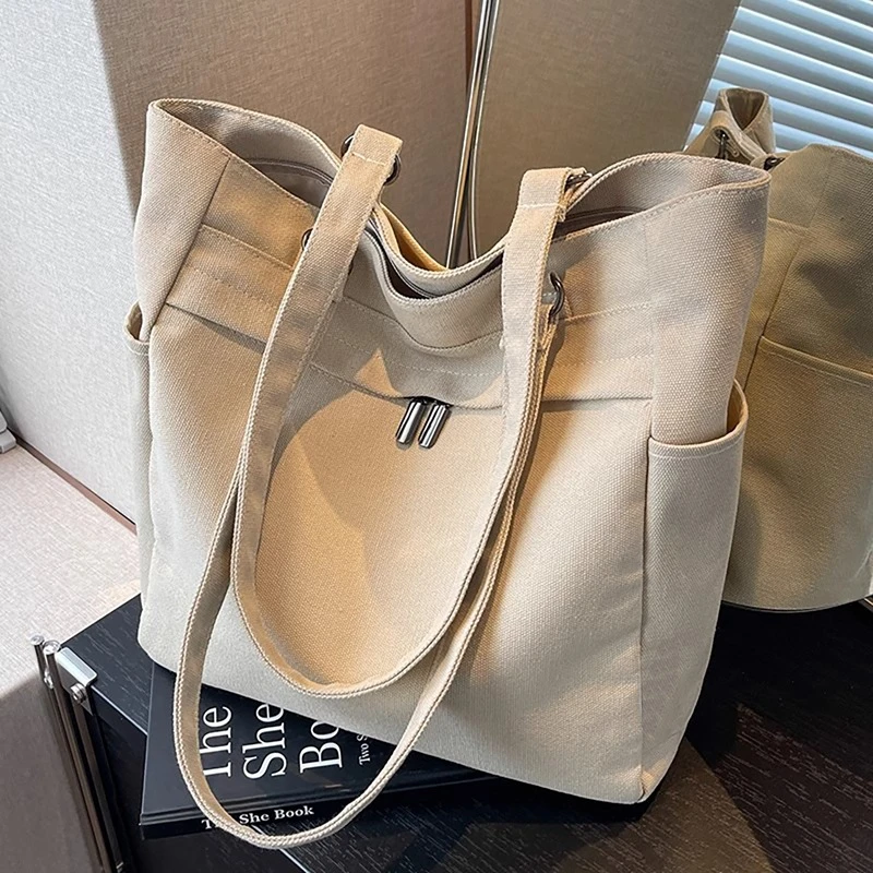 包包2025新款女包夏季大容量帆布包休闲轻便通勤单肩托特包米白色