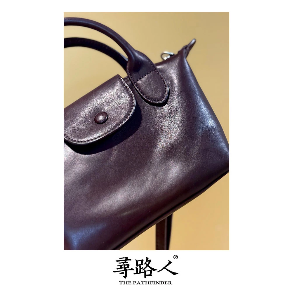 寻路人百搭通勤风牛皮手提斜挎包小饺子包