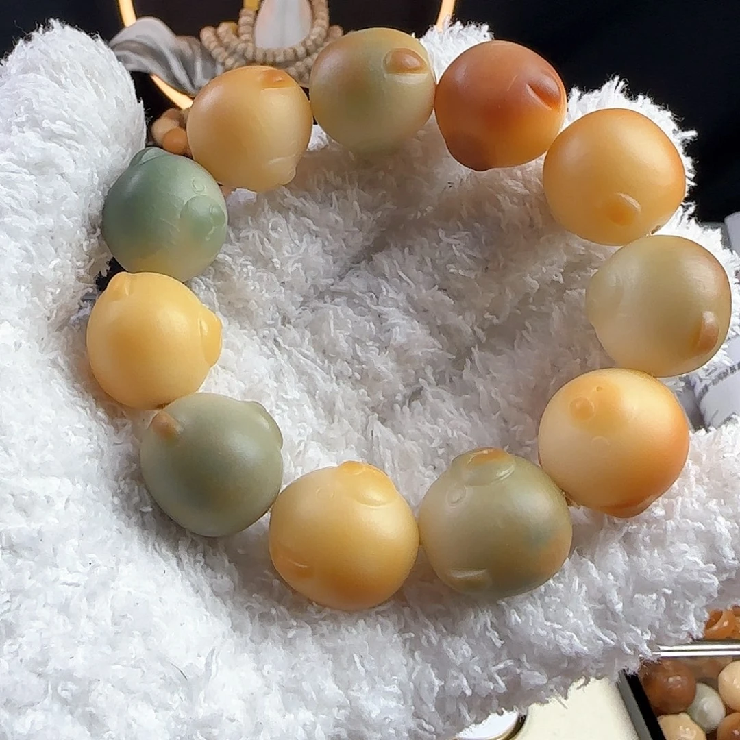 菩提根/象牙果手串川*?瑕疵卡23熊头手串一条