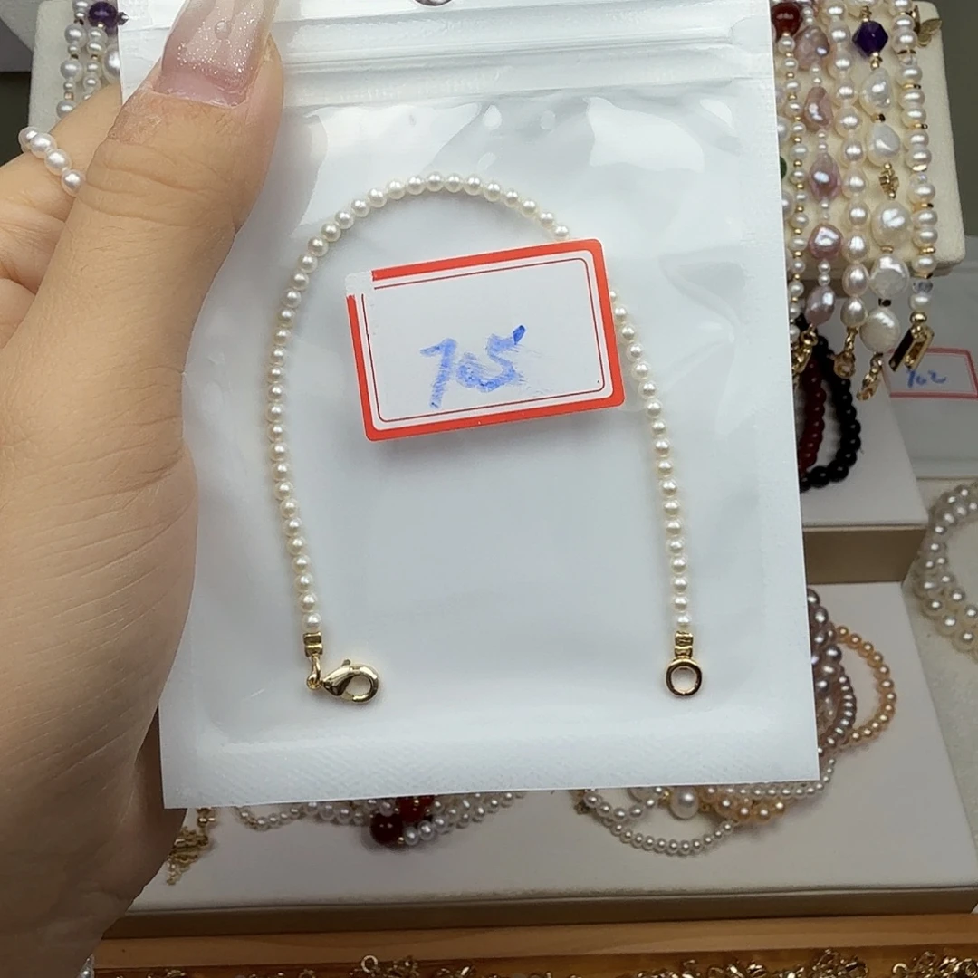 呜***哈钛钢手绳淡水珍珠