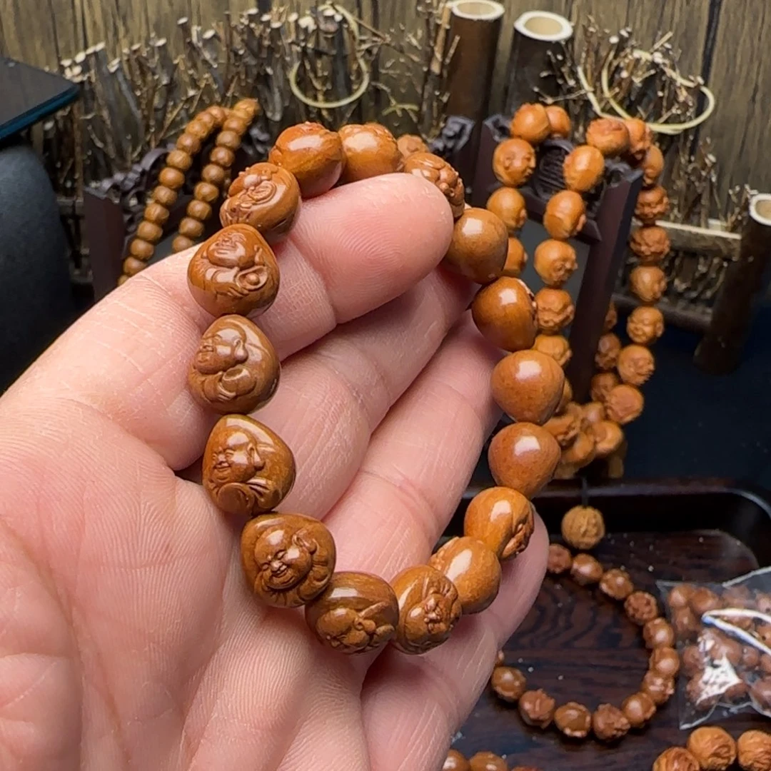 精工机雕手修龙纹桃核财神手串