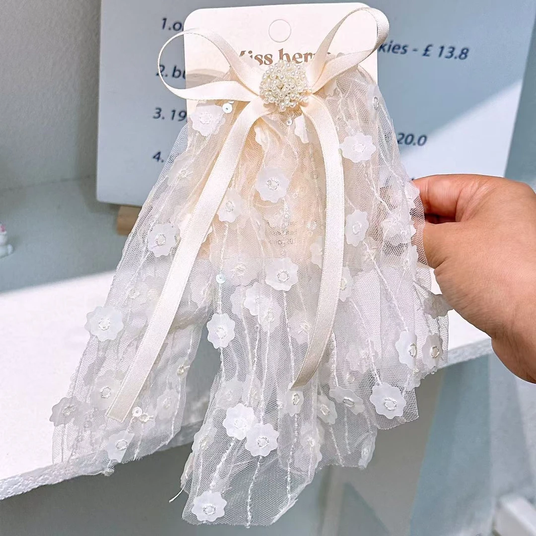 A-6651  hl 1个米白色蝴蝶结珠珠飘带蕾丝公主鸭嘴夹        发圈