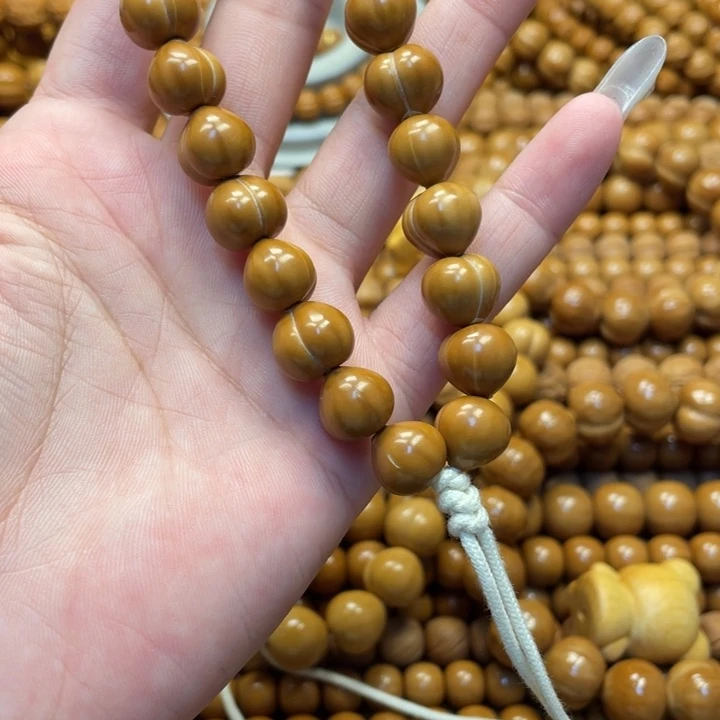 茉***清核桃微瑕亮面屁桃手持