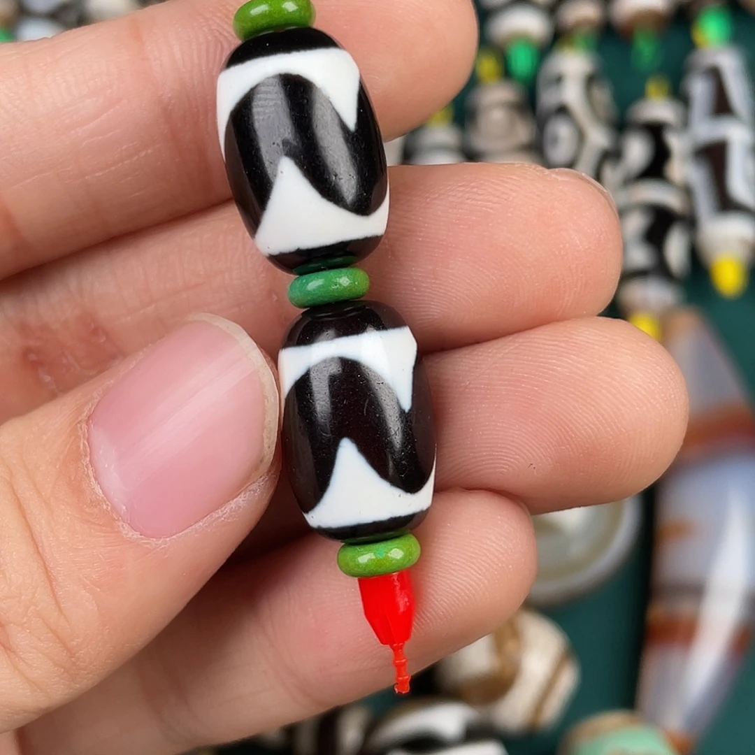 肃***店玛瑙/玉髓裸珠虎牙