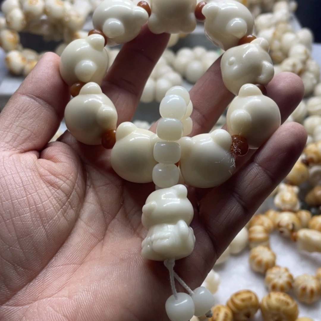 吊坠菩提根/象牙果全品象牙果熊头手串卡22