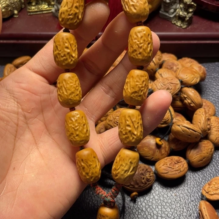 橄榄核雕刻大枣手持