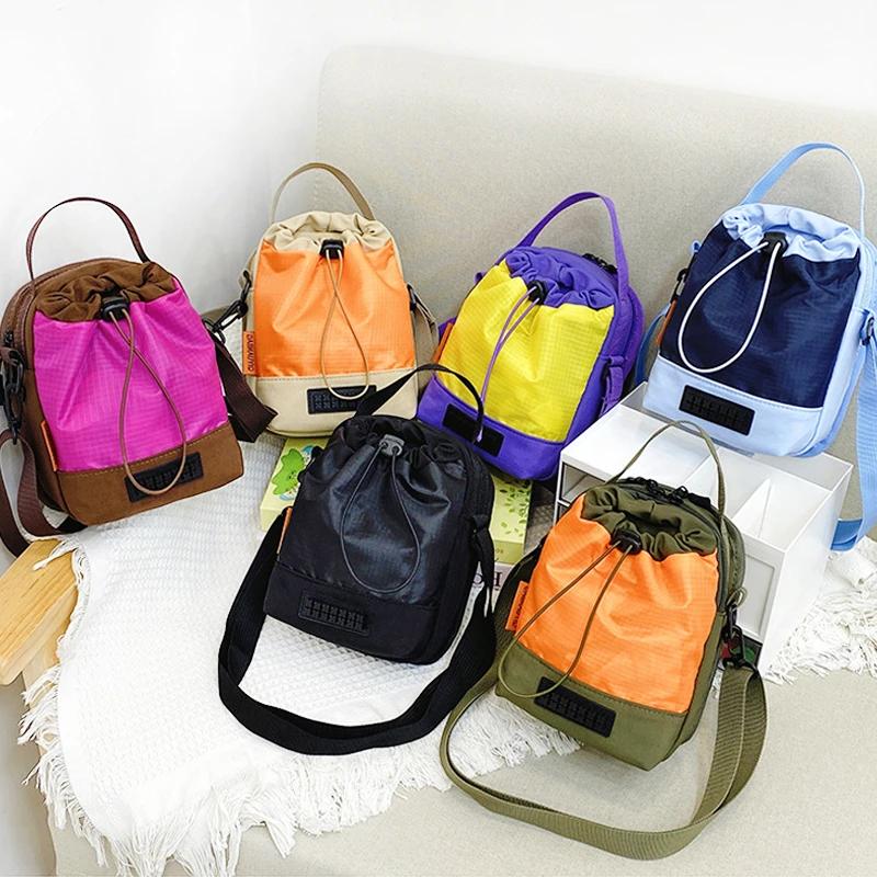 日式撞色轻便旅行单肩斜挎包INS潮牌户外运动水杯包多功能手机包