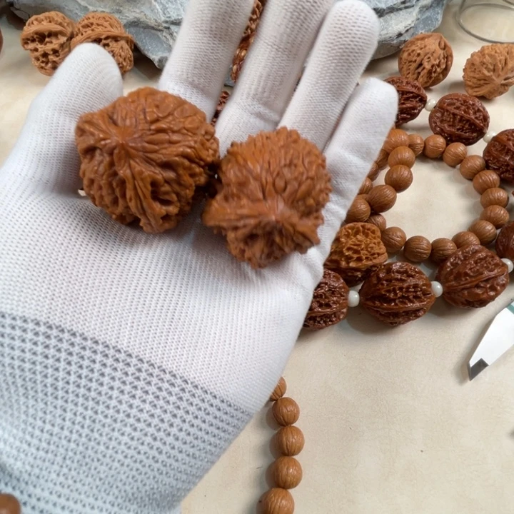 黎***明猴头核桃吊坠异邢