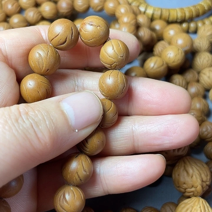 桃核吊坠小***?秦岭龙纹光柱1.2尺30颗