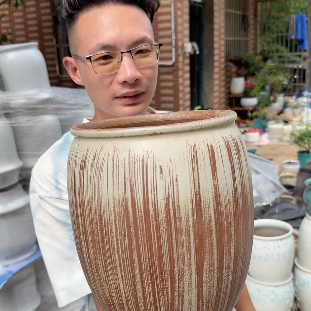 紫砂花盆口19高25（一个竖条老庄搽釉