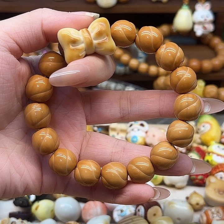 Y***g猴头核桃吊坠扭扭珠蝴蝶