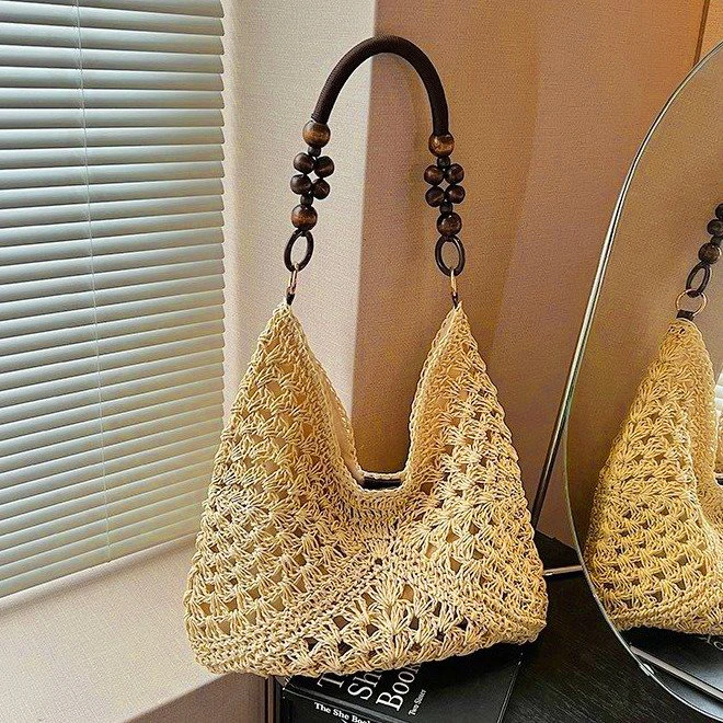 夏天爆款草编包包女2025新款海边沙滩镂空单肩包手提编织菜篮子包