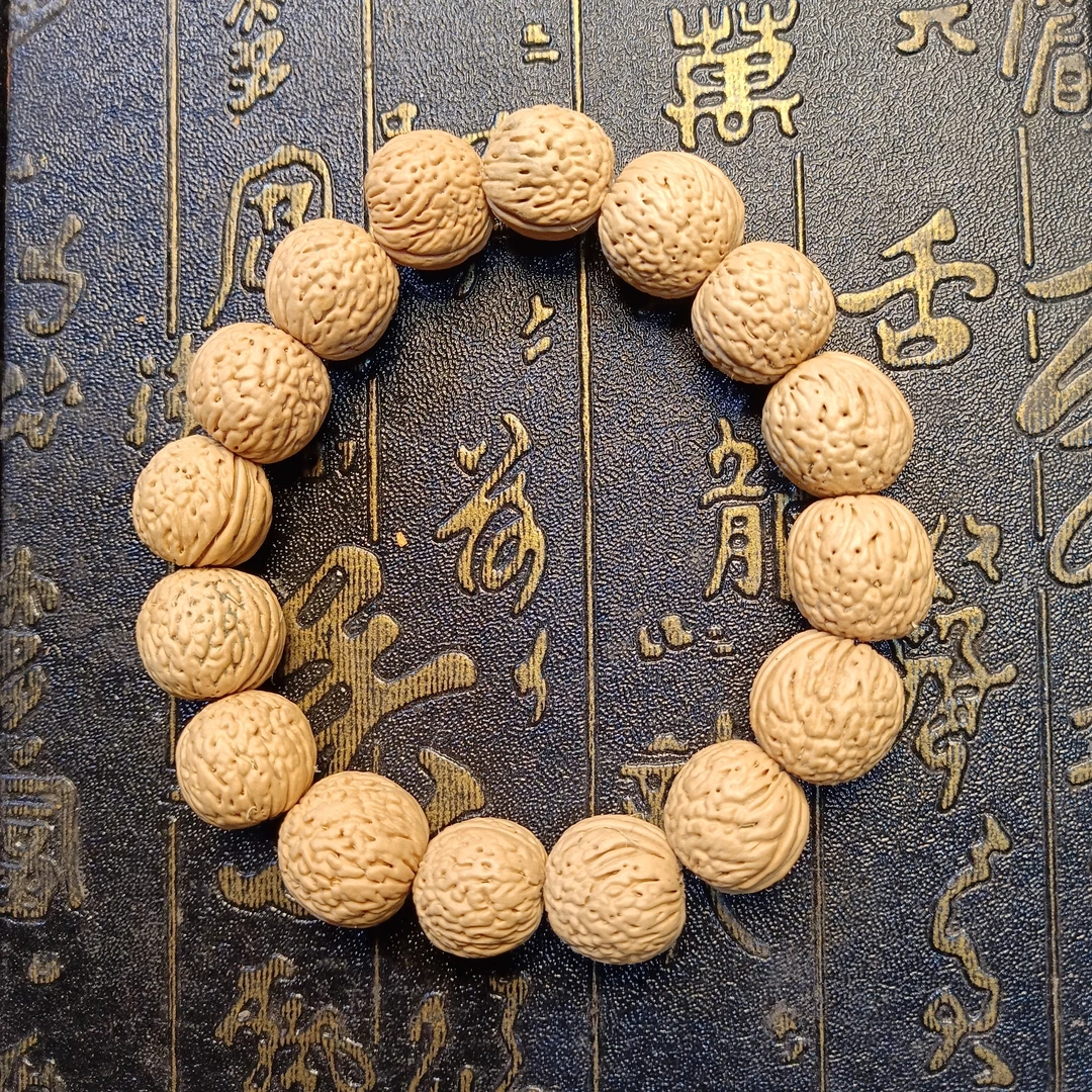 T148 桃核1.6cm单圈手串