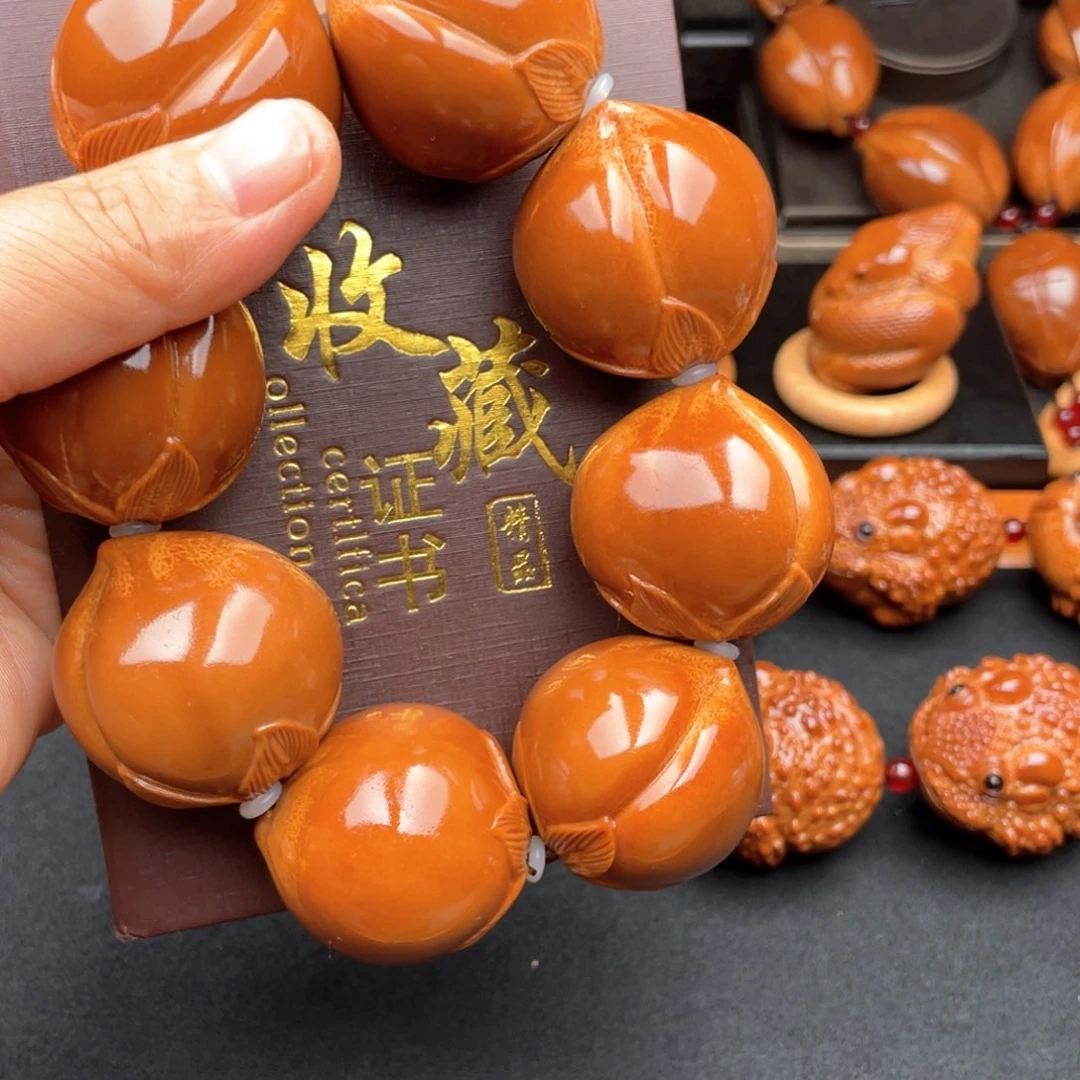 把件橄榄核临**者寿桃手持