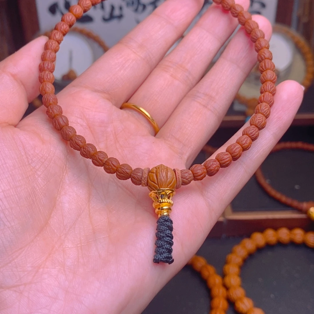 浅***~桃核手串龙纹桃核