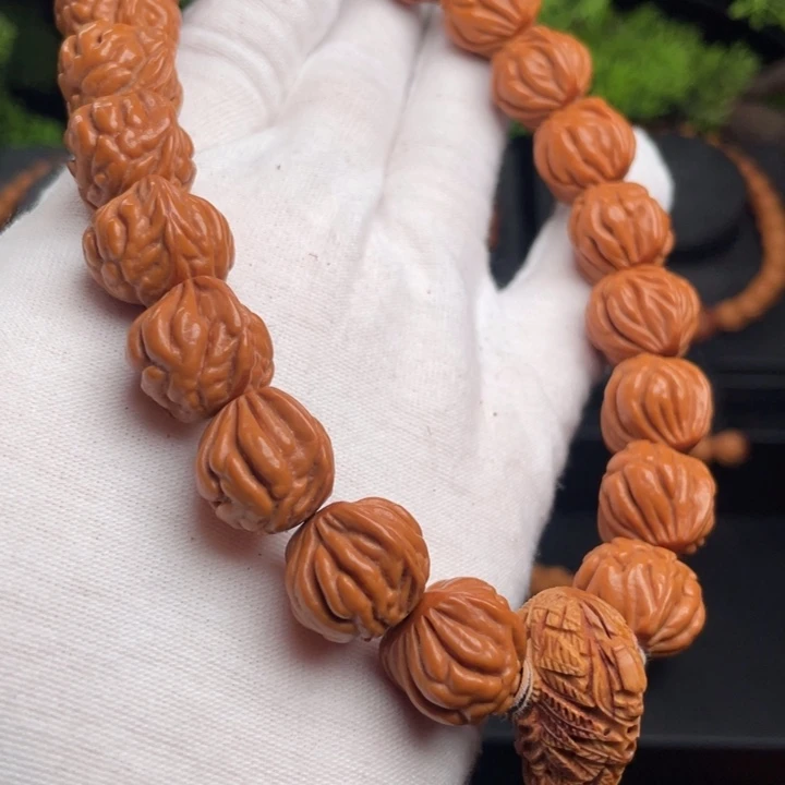 匆***年木质类精品桃核手持