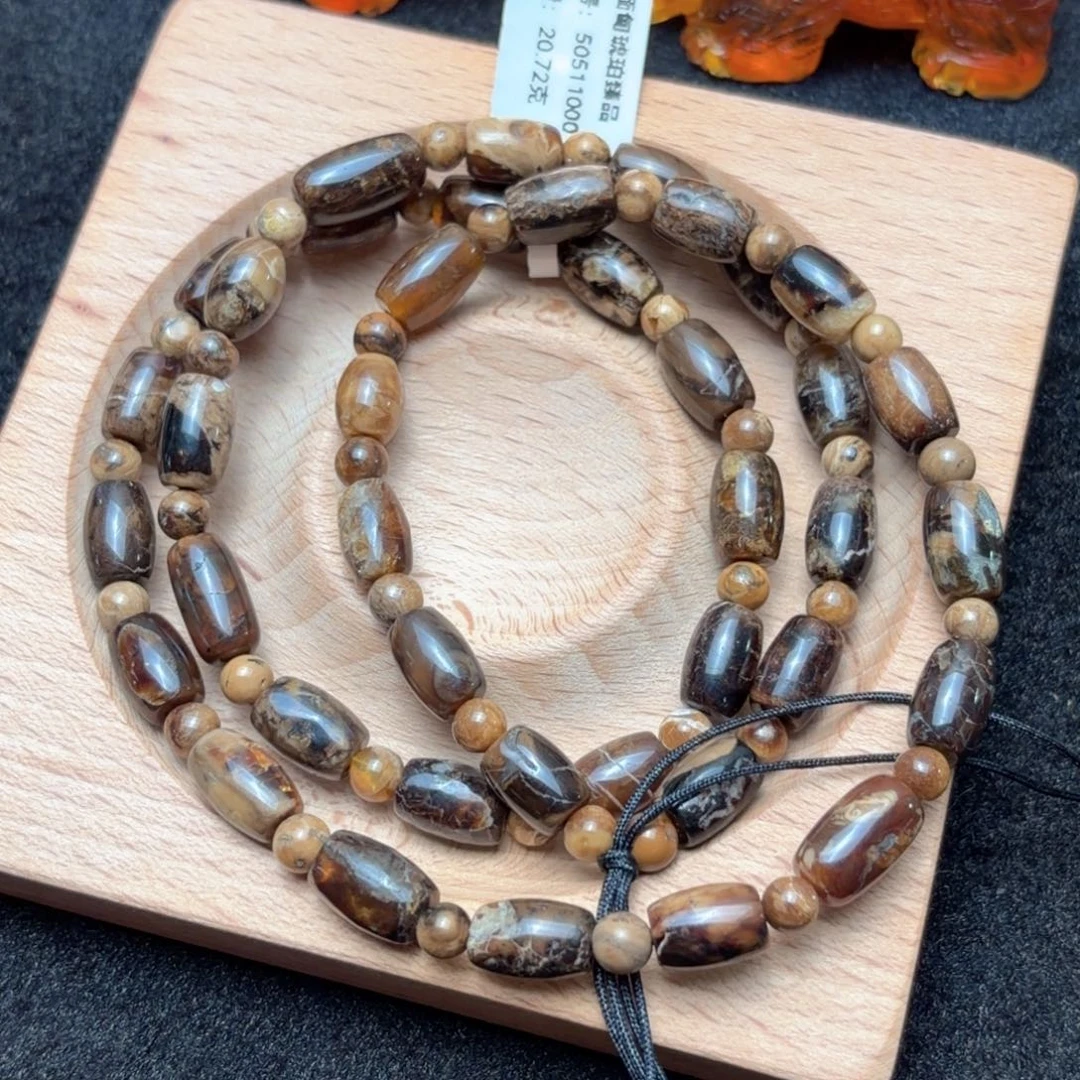 琥珀未镶嵌珠宝奇石7*11mm老油咖啡根桶珠