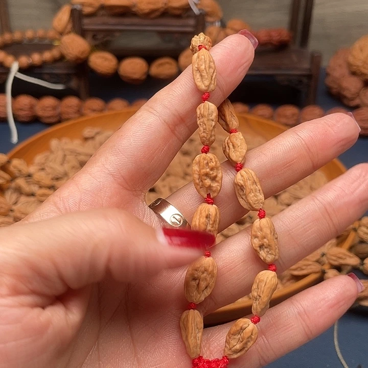 蓝***睛吊坠桃核文玩核桃