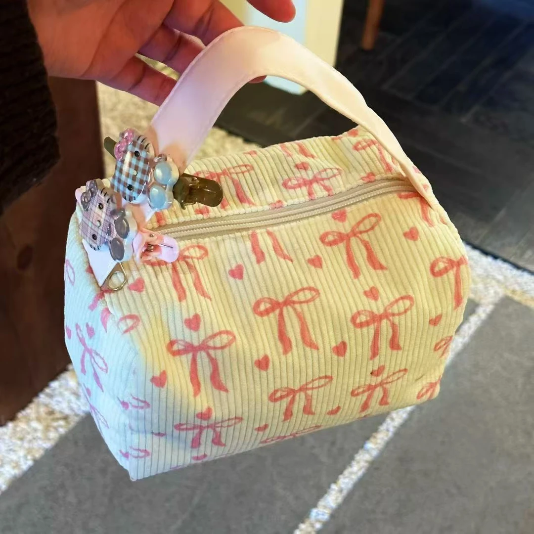 新款蝴蝶结超大容量便携化妆包洗漱包外出旅行手拿包大容量立体