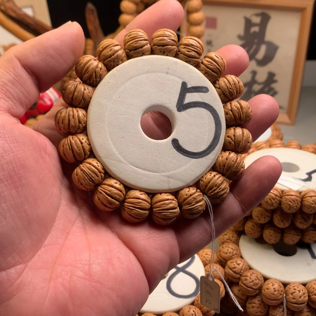 张***.手串桃核1.6树王纽扣货头