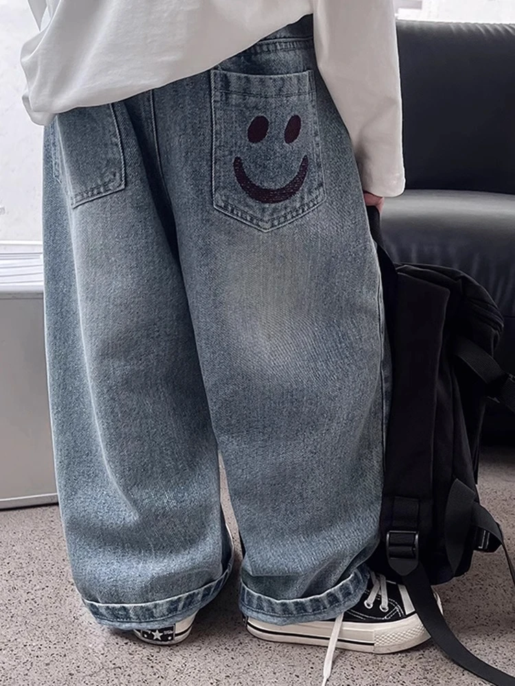 儿童春装2025春秋韩版新款笑脸裤子白塔阔腿刺绣宽松男童牛仔裤长