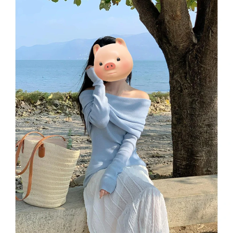 法式气质一字肩蓝色长袖针织衫女2025早春季新款修身显瘦露肩上衣